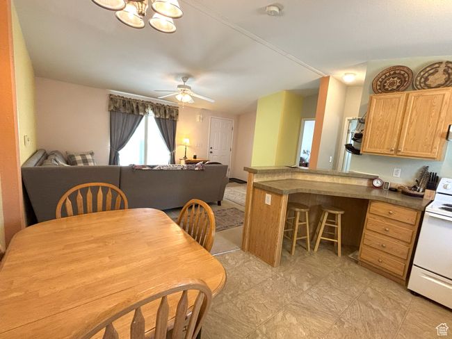Dining space with a ceiling fan | Image 26