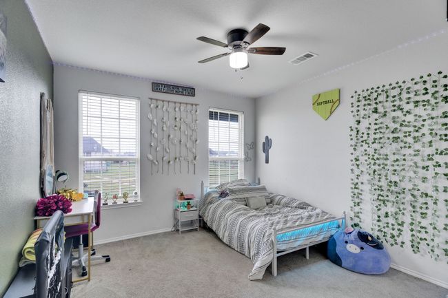 Bedroom with carpet flooring, baseboards, and ceiling fan | Image 15