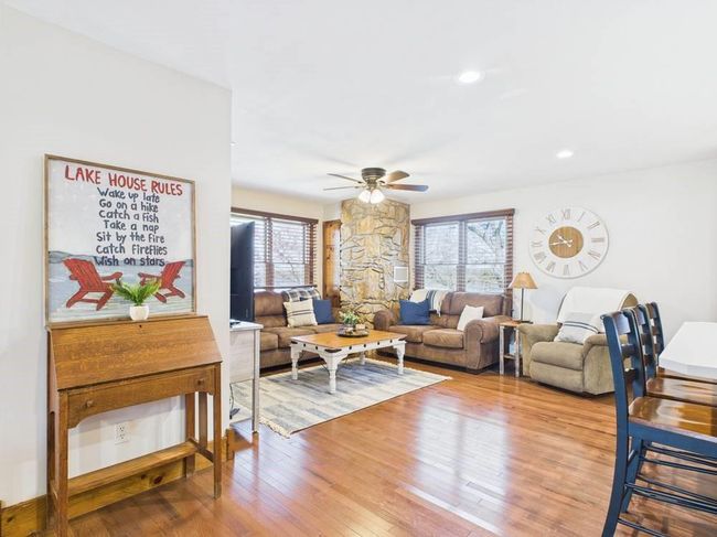 Living area featuring recessed lighting, hardwood floors, and ceiling fan | Image 31
