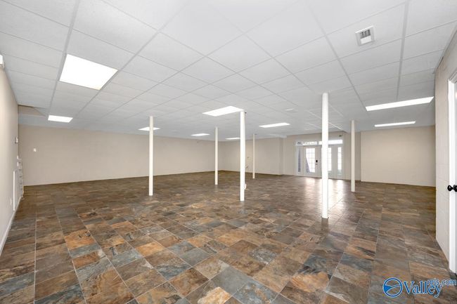 Tile flooring, doors lead to exterior of home, Safe room | Image 38