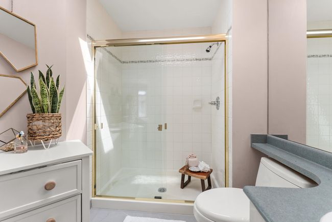 Full bath featuring vanity, toilet, and a stall shower | Image 29