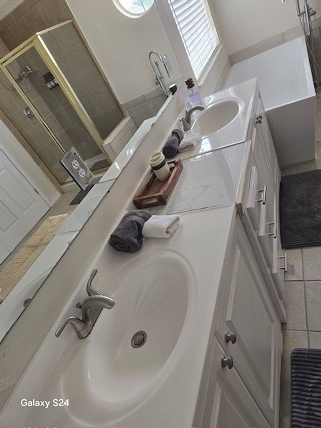 Bathroom featuring vanity and a shower stall | Image 18