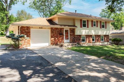 One-car garage with an extra parking pad. | Image 3