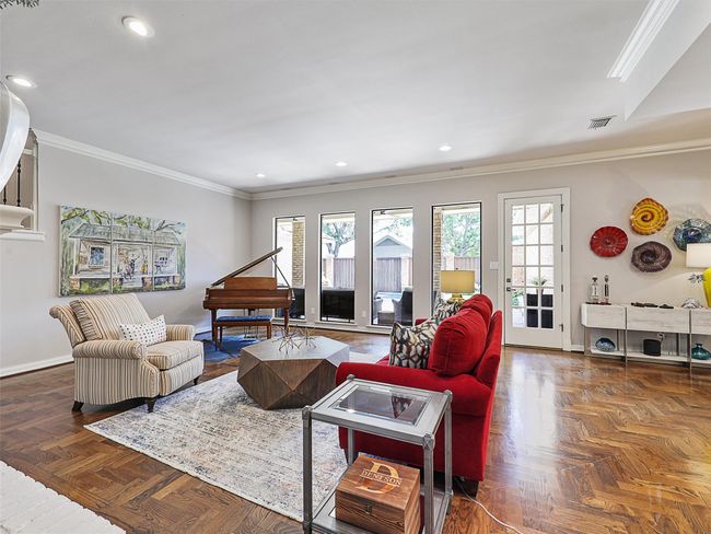 Living area featuring ornamental molding and recessed lighting | Image 5