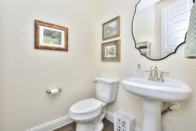 Bathroom with toilet, baseboards, and wood finished floors | Image 18