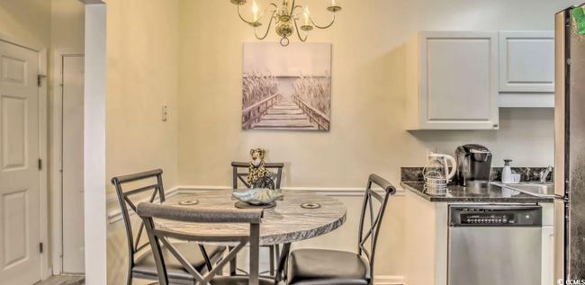 Dining room featuring a chandelier | Image 9