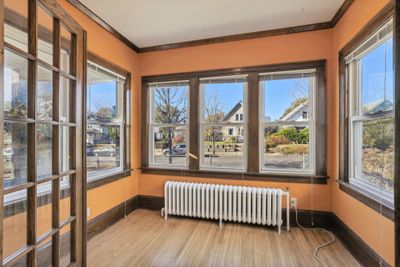 Light-filled sun room with hardwood floors and french doors.... | Image 3