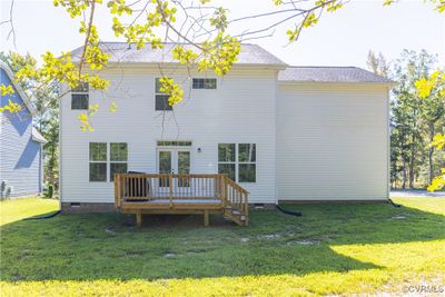 Back of property featuring a yard and a wooden deck | Image 3