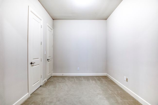 Secondary bedroom with walk-in closet and access leading to full bath. | Image 21