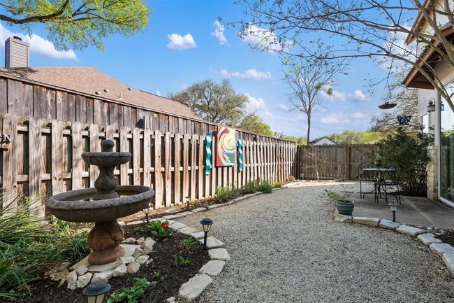 Backyard has three fenced areas. This area is on the primary bedroom side with a patio for peaceful lounging. | Image 31