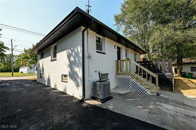 View of side of home featuring central AC | Image 3