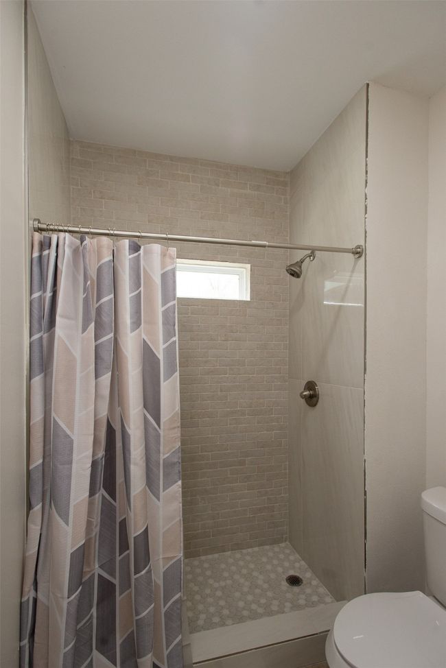 Bathroom with toilet and walk in shower | Image 34