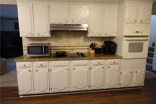 Fully equipped kitchen with abundant countertop space and cabinetry | Image 7