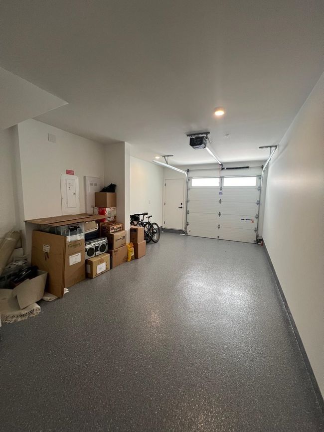 Garage with a garage door opener | Image 14