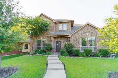 Front facade featuring a front yard | Image 1