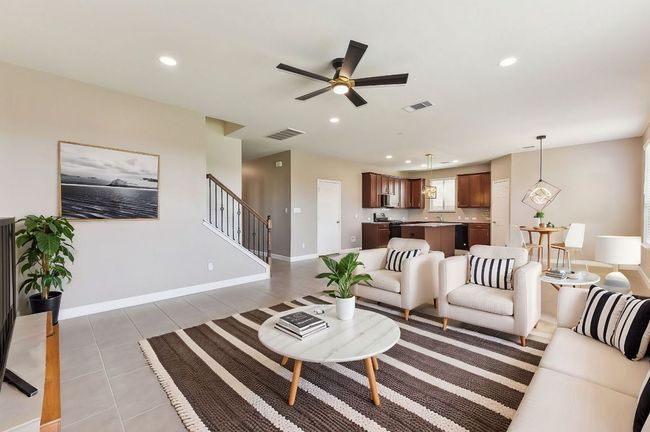 Living room featuring recessed lighting, visible vents, stairway, and a ceiling fan | Image 11