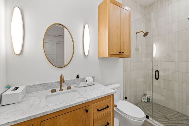 Full bathroom with vanity and a shower stall | Image 12