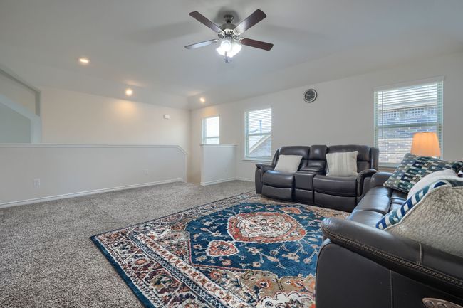 Living area with ceiling fan, carpet floors, baseboards, and recessed lighting | Image 25