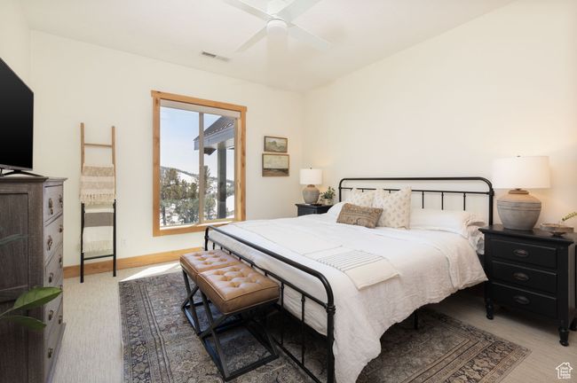 Bedroom featuring a ceiling fan, baseboards, and visible vents | Image 18