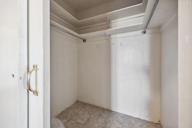 View of spacious closet | Image 12