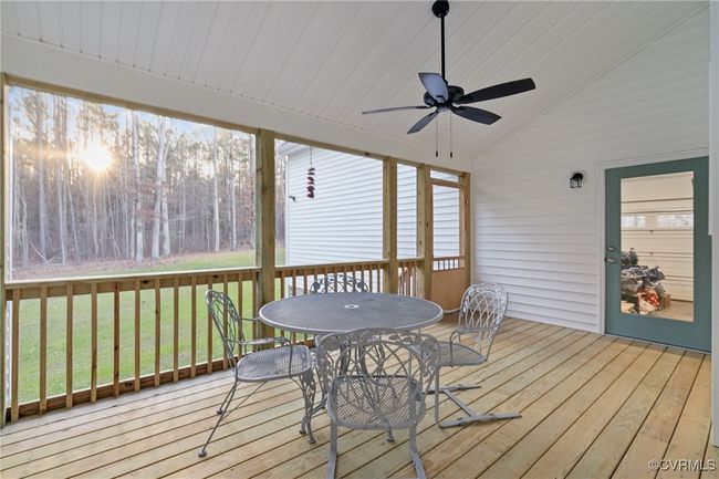 Sunroom featuring vaulted ceiling and a ceiling fan | Image 44