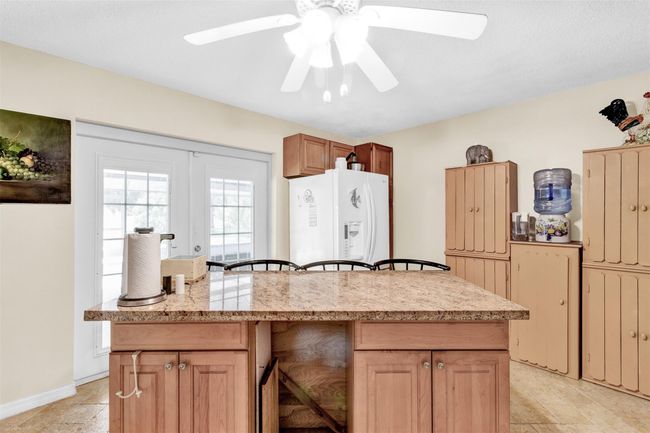 French doors lead to pool area | Image 7