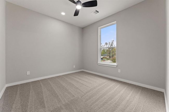 Second upstairs bedroom. Perfect for family members or as an extra guest room, offering plenty of natural light. | Image 14