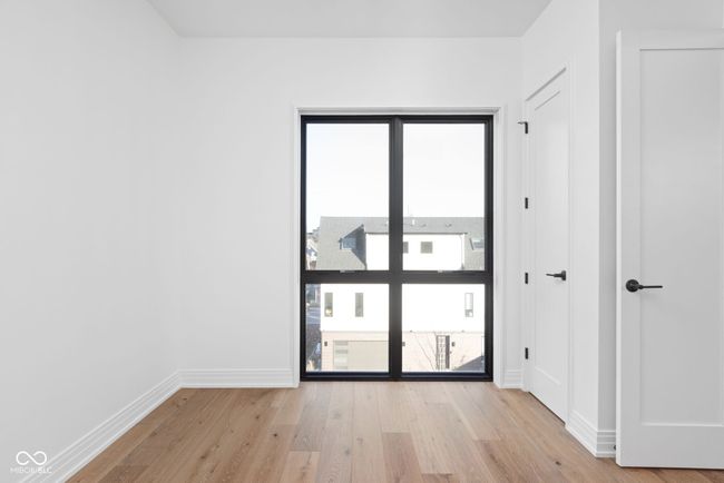 Primary bedroom with walk-in closet and 8ft floor length window | Image 29