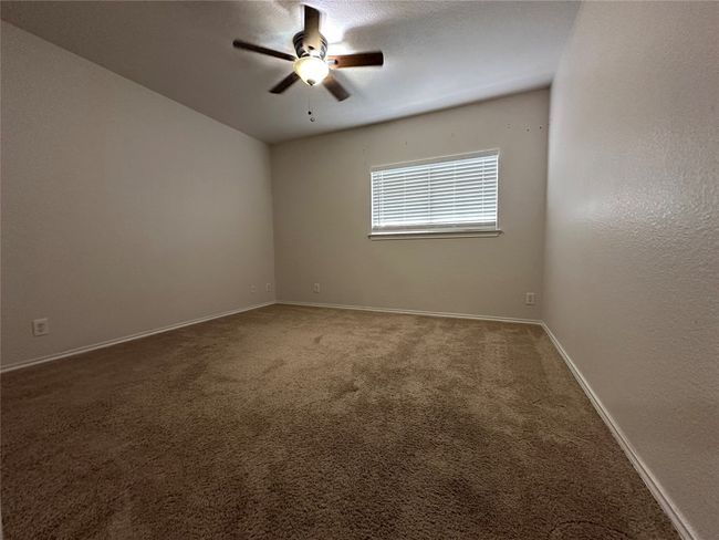 Spare room featuring a ceiling fan and carpet floors | Image 27
