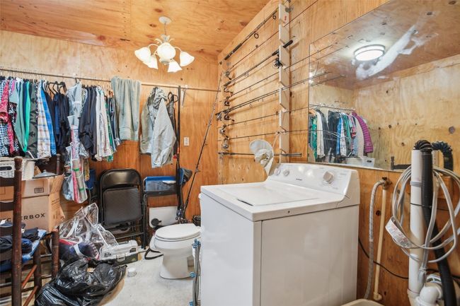 View of insulated shop with HVAC, toilet and washing machine connections | Image 36