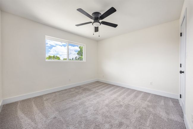 Spare room with light colored carpet and ceiling fan | Image 32