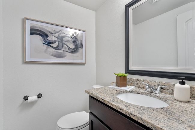 The half bathroom is thoughtfully designed for convenience, featuring modern fixtures and a sleek, functional layout. | Image 17