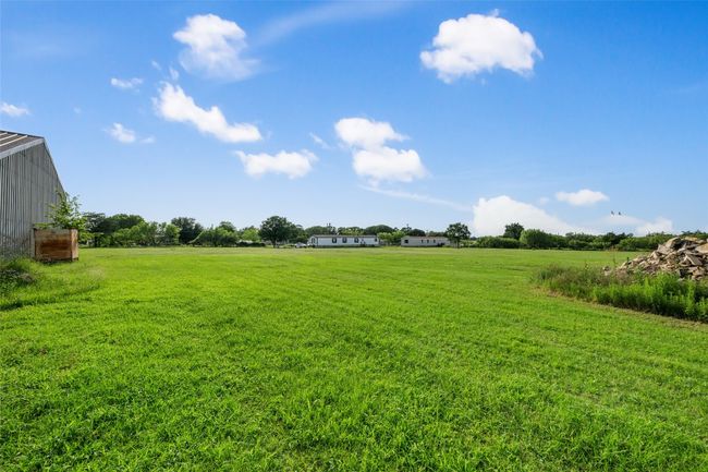 View of grassy yard featuring a rural view | Image 5