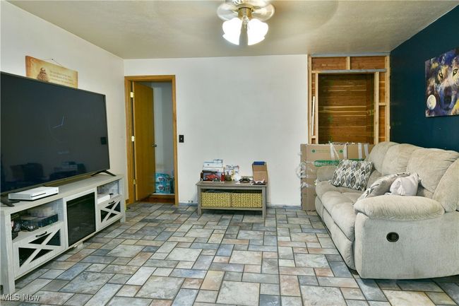 Living area with a ceiling fan | Image 15