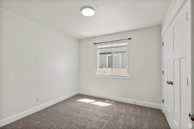 Empty room featuring carpet flooring and baseboards | Image 15
