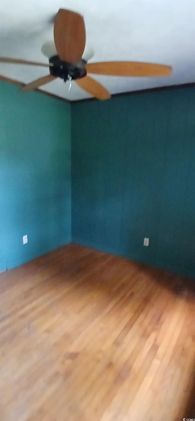 Spare room with wood finished floors and ceiling fan | Image 27