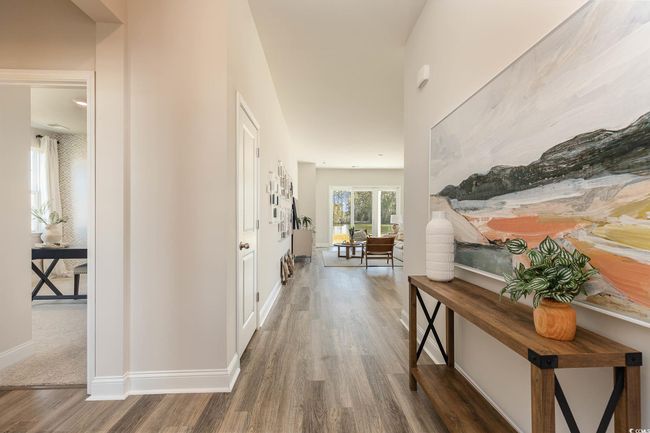 Hall with wood finished floors and baseboards | Image 4
