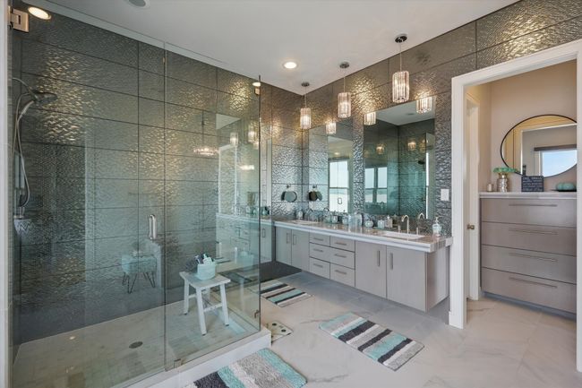 Full bath featuring vanity, marble finish floor, and a stall shower | Image 31