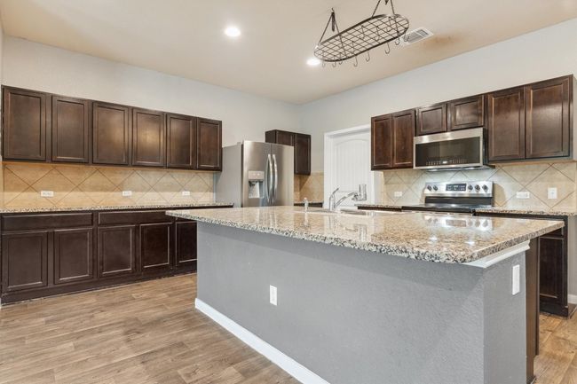 1008 Comal Run, House other with 4 bedrooms, 3 bathrooms and 4 parking in Hutto TX | Image 10