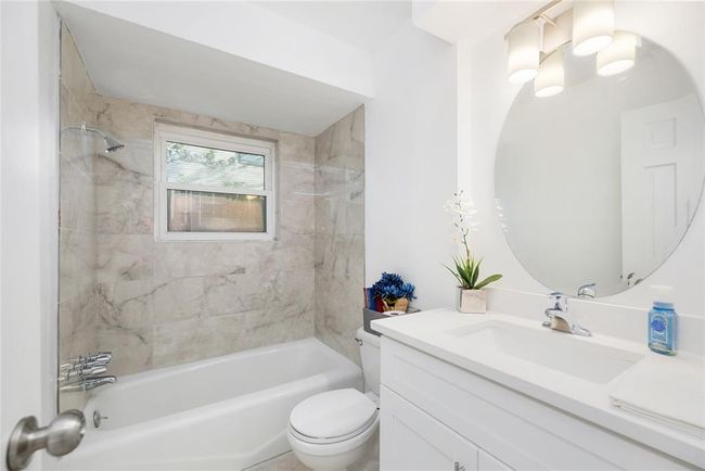 Fully updated Bathroom, right next to the office or study. This area also has closet, this could also be a 5th room with full bath | Image 23