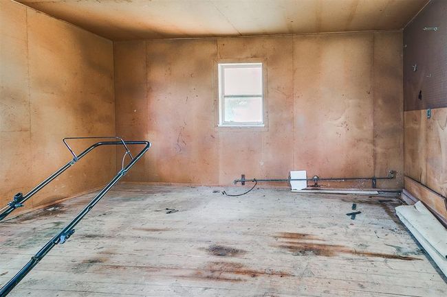 Lots of room for a workshop or possibly another bedroom and half bath. | Image 24