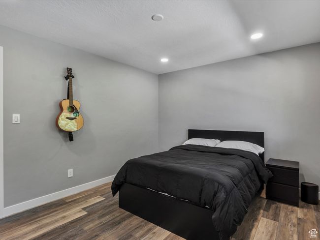 Bedroom featuring wood finished floors and recessed lighting | Image 26