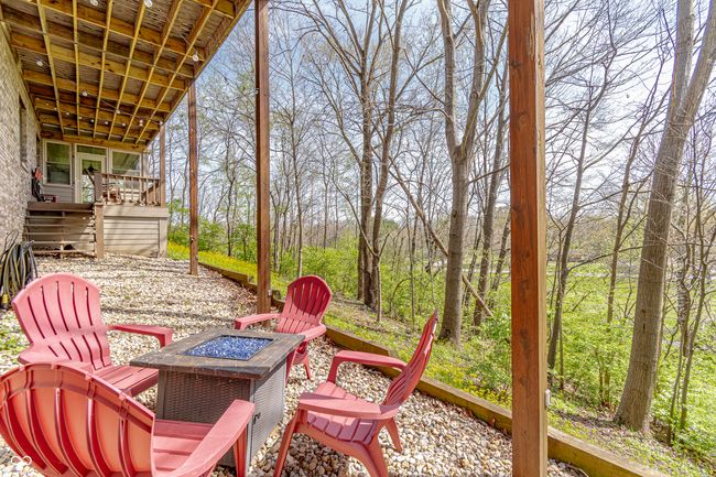 view of patio with a fire pit and a deck | Image 45