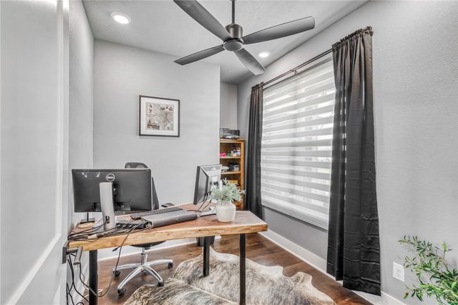 Office area featuring wood-type flooring and ceiling fan | Image 10