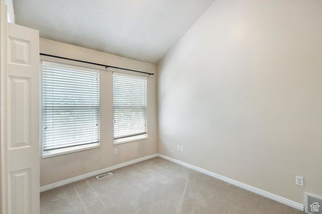 Bedroom with baseboards and lofted ceiling | Image 26
