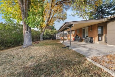 View of yard featuring a carport | Image 3