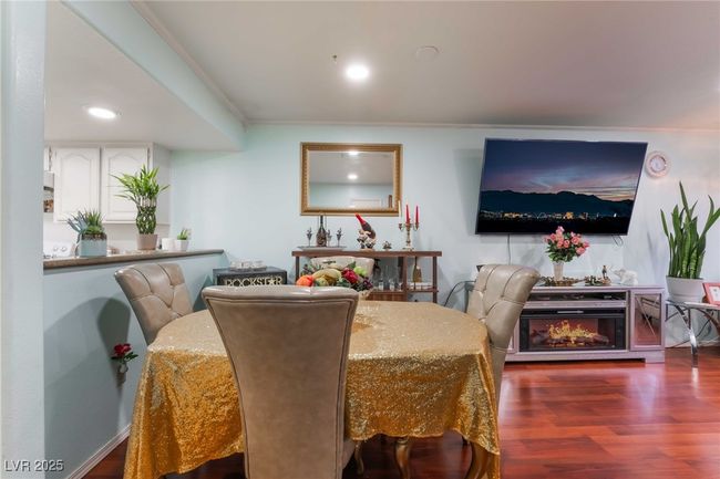 Dining area featuring crown molding, recessed lighting, and wood finished floors | Image 11