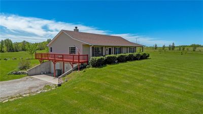 Back of property featuring a yard and a wooden deck | Image 2