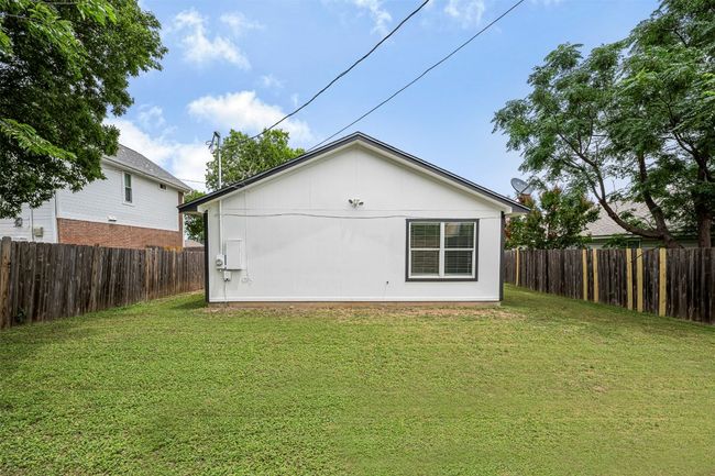 Rear view of house featuring a fenced backyard | Image 33