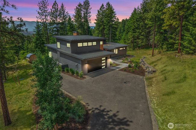 Situated on 5 stunning view acres, this home offers unmatched privacy nestled among towering timber. Enjoy Breathtaking vistas and peaceful seclusion, all with the convenience of easy, year-round access—mountain living without compromise | Image 38